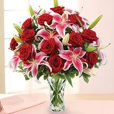 ONE DOZEN RED ROSES AND PINK LILIES
